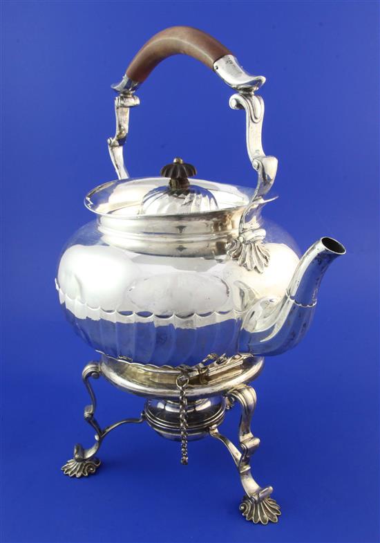 A late Victorian silver tea kettle on stand and later associated plated burner, gross 51 oz.